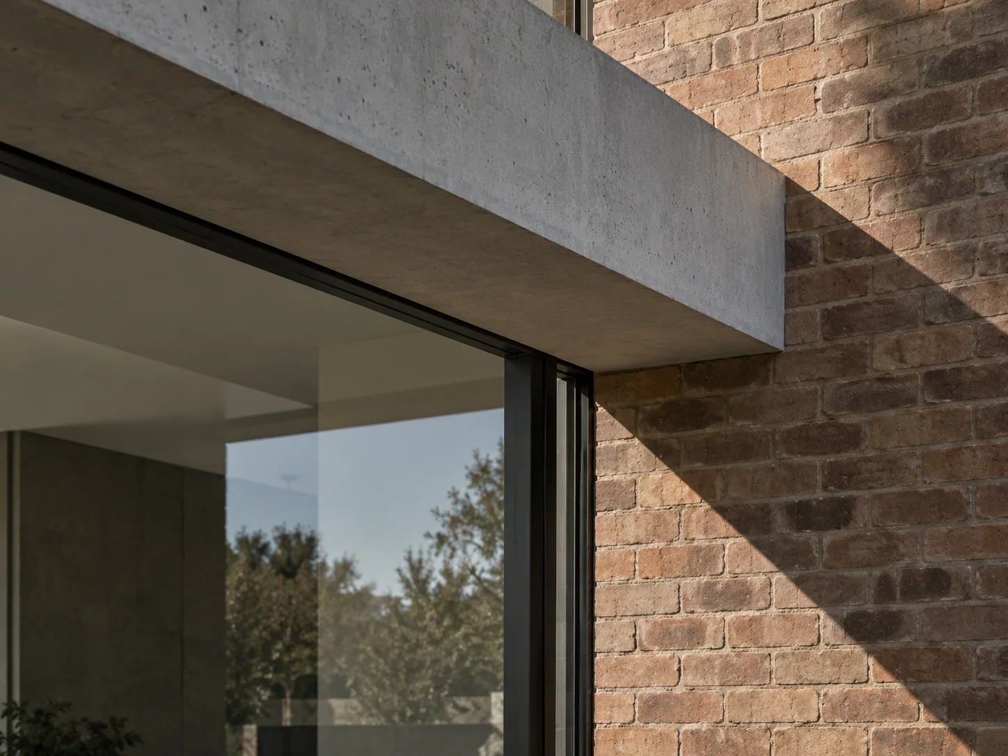 Illustrative detail of contemporary residential concrete, brick and glazing